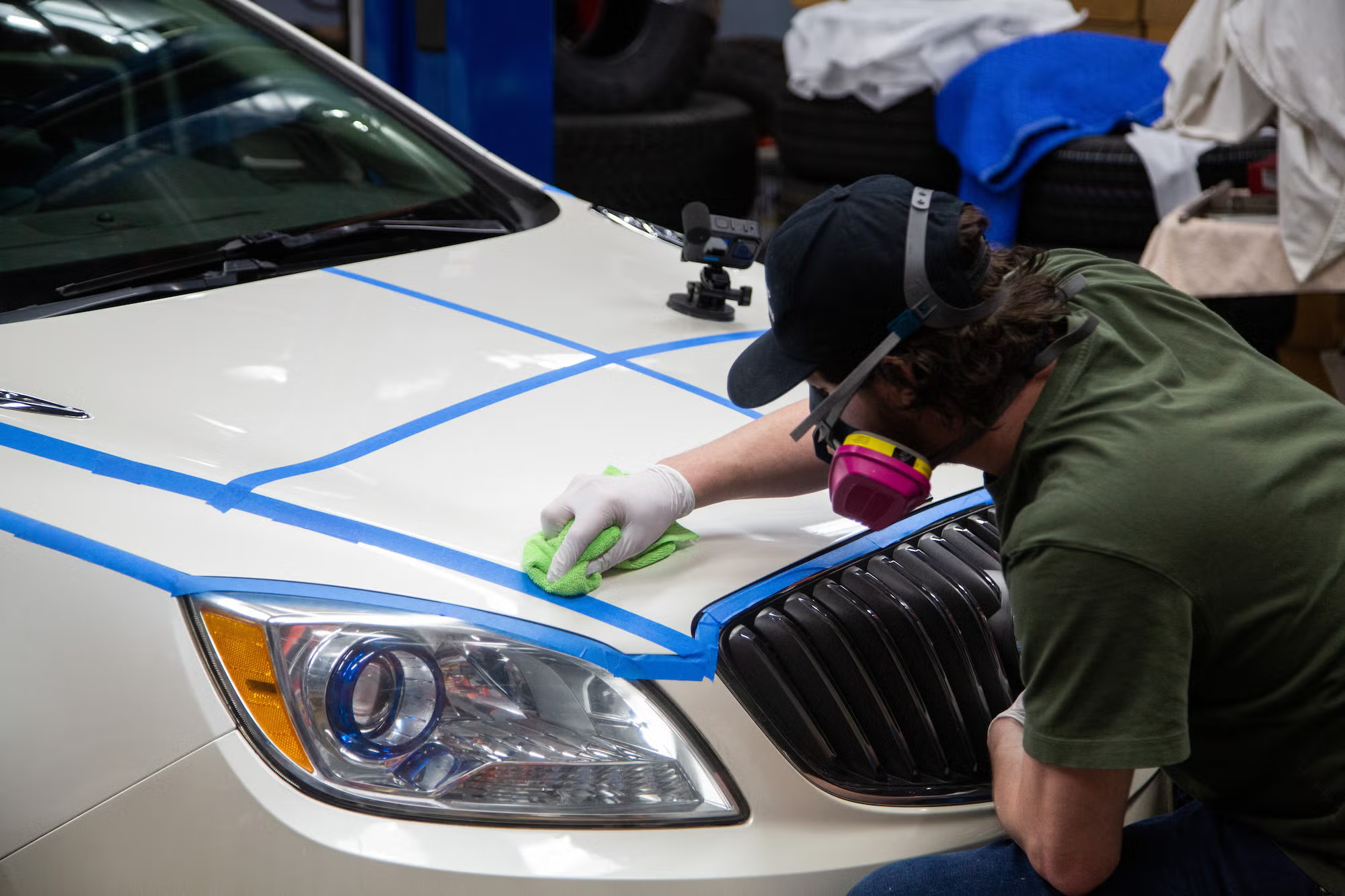 Paint correction in progress on a white vehicle at Glasshouse Automotive